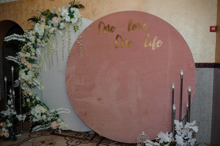 Elegant Wedding Backdrop with Floral Arrangements and Inspirational Quotes.の写真素材