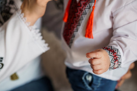 Traditional Ukrainian Embroidery Clothing on Child with Adorned Sleeves.の写真素材