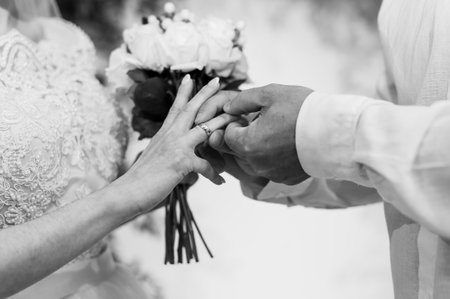 A Romantic Moment: Wedding Ring Exchange Between a Bride and Groom.の写真素材