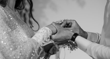 A Close-Up of a Romantic Wedding Ring Exchange Ceremony.の写真素材