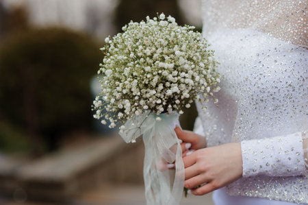 Elegant Bride Holding a Delicate Baby's Breath Bouquet.の写真素材