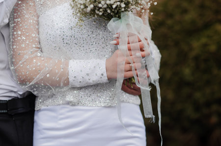 Elegant Bridal Moment with Sparkling Details and Floral Bouquet.