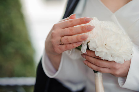 Elegant Bride Holding White Chrysanthemum Bouquet.
