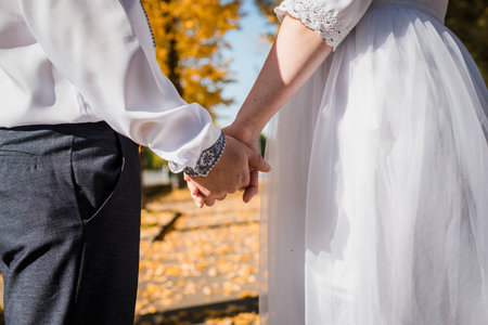 Romantic Engagement Moment Amidst Autumn Leaves.の写真素材