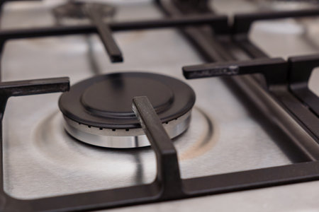 Close-up of a Modern Gas Cooktop Burner.の写真素材