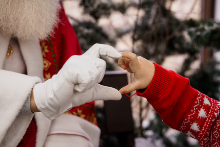 Heartfelt Connection Between Santa Claus and a Child.の写真素材
