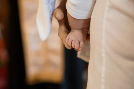 Tender Moment of Connection Between an Adult and a Babys Handの写真素材