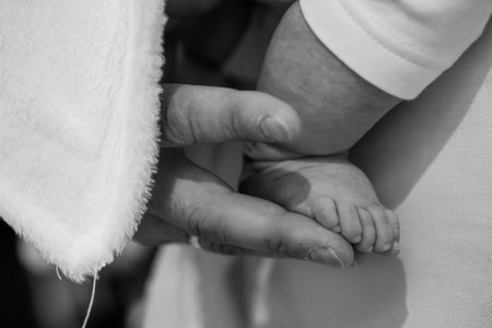 Tender Moment of Connection Between Parent and Newborn Baby Handの写真素材