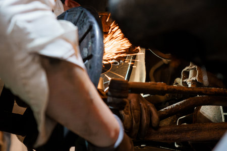Sparks Flying: A Mechanic Working on a Vehicle's Undercarriage.