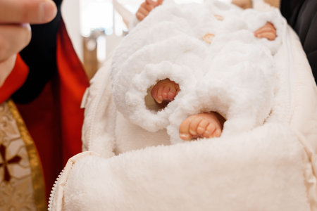 Tender Moment: A Close-up of a Baby Wrapped in a Cozy White Blanket.