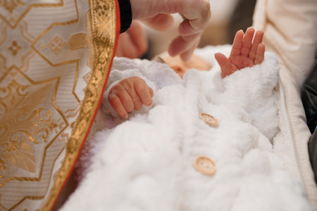 Christening Ceremony with Infants in Traditional Garb.の写真素材