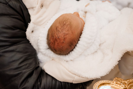 Newborn Baby Wrapped in Cozy White Blanket with Glowing Bundle of Joy.