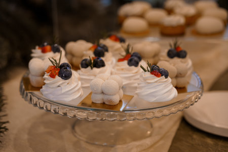 Exquisite Dessert Display Featuring Whipped Cream Confections and Fresh Berries.の写真素材