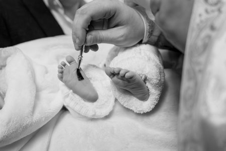 Tender Moments: A Parent's Gentle Touch Painting Tiny Toes.の写真素材