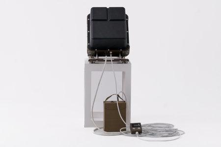 Compact Electronic Warfare System with Control Unit and Connective Cables.