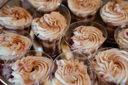 A close-up view of individual chocolate dessert shooters beautifully decorated with a swirled...