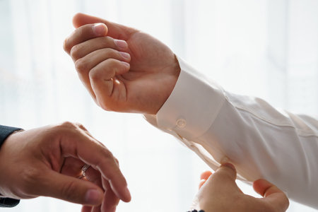 Formal Attire Assistance: Man Getting Cufflinks Fastened, White Shirt, Business Style, Close-Up,...