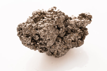 A detailed view of a pyrite mineral specimen with sharp cubic crystals and reflective surfaces,...