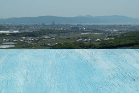 Wooden blue table against the background of the beautiful skyの写真素材
