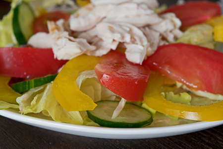 Healthy salad with chicken and vegetables tomato cucumberの写真素材