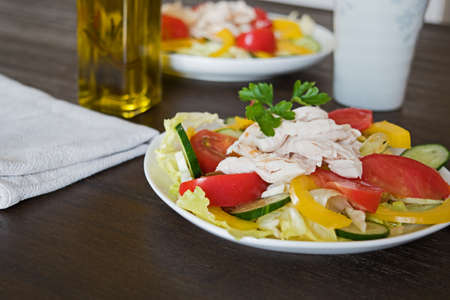 Healthy salad with chicken and vegetables tomato cucumberの写真素材