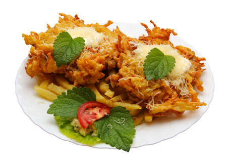 grilled meat served with salad and garnish.の写真素材