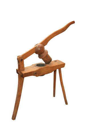 An isolated old wooden rural potato press.の写真素材