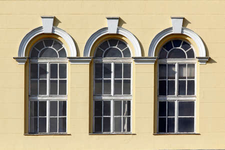 Wall with three tall gothic glass windows