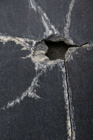 Fracture crack black marble surface.の写真素材