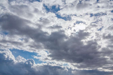 Sun shines through the overcast sky in cloudy weather - image, photo