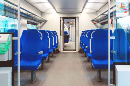 Interior of an empty passenger car commuter trainの写真素材