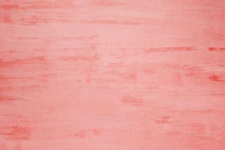 Old wooden board painted with coral paint, background, textureの写真素材