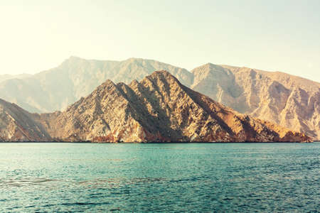 Sea and rocky shores in the fjords of the Gulf of Omanの写真素材