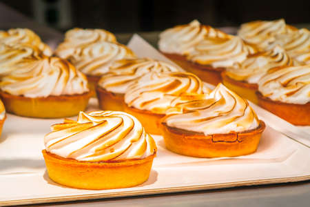Cakes baskets with meringue laid out for sale in a cafeの写真素材