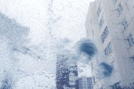Windshield from inside the car during heavy snowfallの写真素材