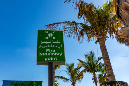 Dubai, United Arab Emirates - December 12, 2018: Fire Assembly Point Sign in Arabic and Englishのeditorial素材