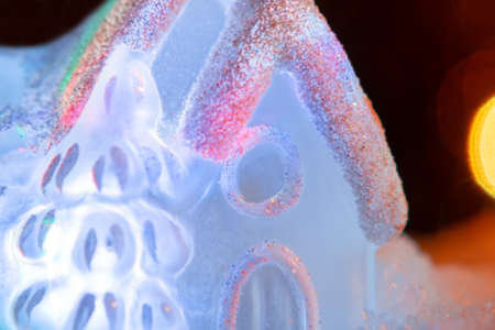 Glowing toy house close-up. Festive, Christmas or New Year conceptの写真素材