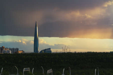 huge thundercloud on the outskirts of the city before the rain - image