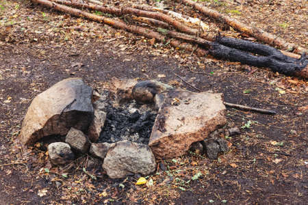 Campfire place among stones in the forestの写真素材