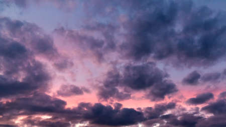 Colorful dramatic clouds at sunsetの写真素材