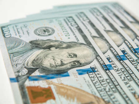 A few dollar bills lie on the table, closeup