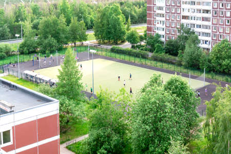 SAINT-PETERSBURG, RUSSIA - JUNE 16, 2018 Children playing on the football field near the schoolのeditorial素材