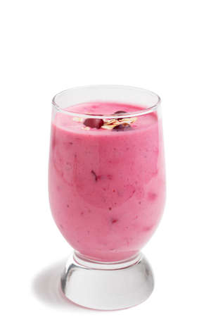 Freshly homemade smoothie of yogurt, oatmeal and cranberries isolated on white backgroundの写真素材
