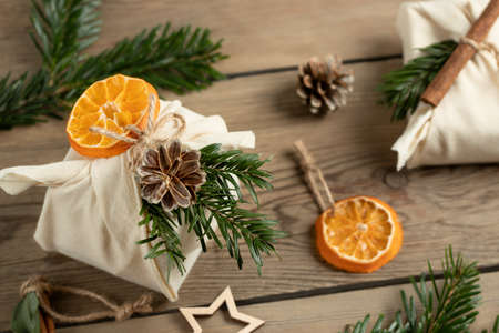 Zero waste christmas concept. Packed in natural fabric gifts and decorations from natural materials...