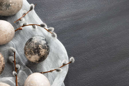 Easter composition - several painted with natural dyes with marble effect on the table, top view, copy spaceの写真素材