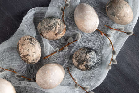 Easter composition - several painted with natural dyes with marble effect on the table, top viewの写真素材
