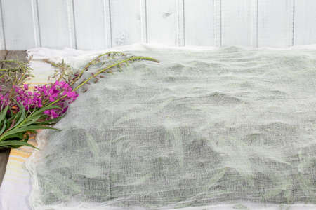 Harvesting fireweed for tea - drying spread leaves and flowers under a thin clothの写真素材