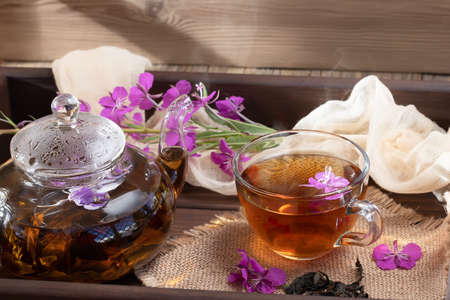 Herbal tea made from fireweed known as blooming sally in teapot and cup.の写真素材