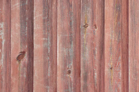 Surface of the old wall sheathed with wooden boards, wooden background, textureの写真素材