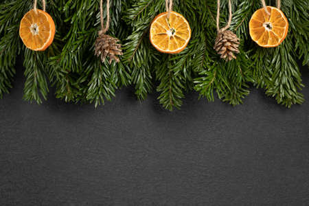 Zero waste and eco friendly christmas concept. Christmas tree branches with natural decorations on a...
